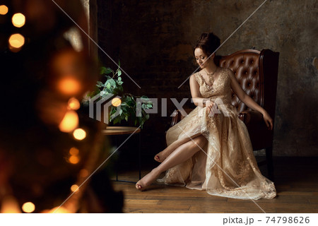 Red-haird girl in loft interior retro style 74798626