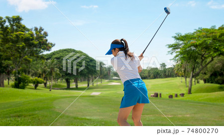 Golfer sport course golf ball fairway. People lifestyle woman playing game golf tee of on the green grass.  74800270