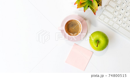 Healthy snack and lunch with working in office.  Top view Green apple with back coffee pink cup 74800515