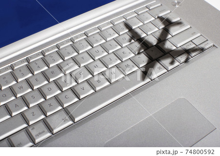 Shadow of jumbo jet over apple macintosh keyboard Shadow of jumbo jet over apple macintosh keyboard 74800592
