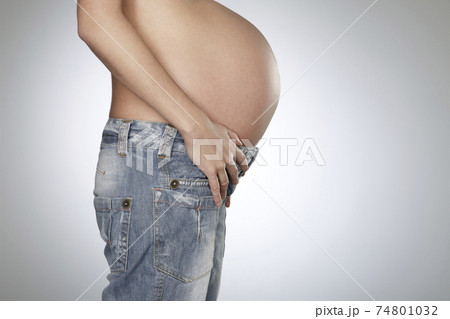 Pregnant Woman Wearing Jeans 74801032