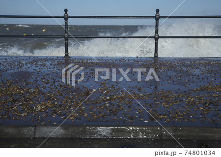 Water crashing over rail 74801034