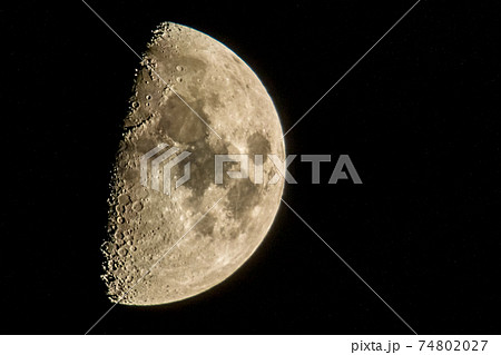 half moon in the night sky in december half moon in the night sky in december 74802027