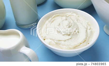 Whipped cream on blue background, top view 74803965
