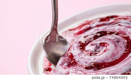 Yogurt with fruit jam, curd cream swirl with berry topping Yogurt with fruit jam, curd cream swirl with berry topping 74804003