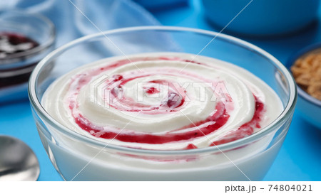 Yogurt with berry jam, blueberry whipped cream 74804021