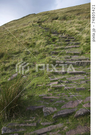 Stone path leading up hill 74805421