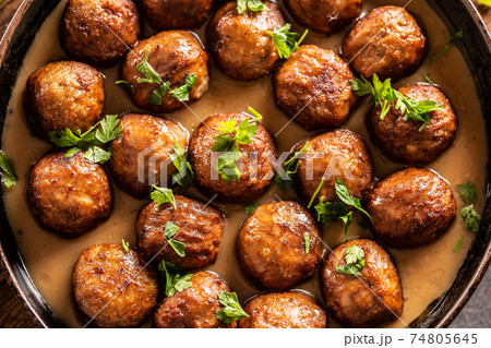 Top view of a pan with freshly-made kottbullar meatballs in a sauce 74805645