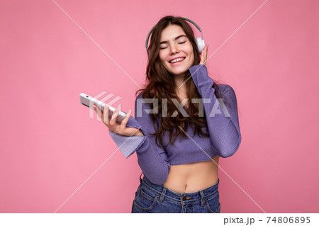 Photo of beautiful joyful smiling young woman wearing stylish casual clothes isolated over 74806895