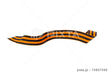 St. George ribbon on a white background. Black orange ribbon close up on a white background. 74807499