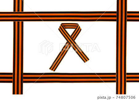 St. George ribbon on a white background. Black orange ribbon close up on a white background. 74807506