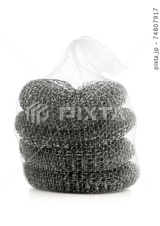 Iron brush for washing dishes. Several iron brushes close-up on a white background. 74807917