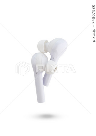 Wireless headphones on a white background. Close-up wireless headset. Wireless headphones on a white background. Close-up wireless headset. 74807930