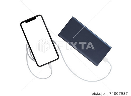 Power bank and smartphone on white background. The smartphone is charging from the power bank. Power bank and smartphone on white background. The smartphone is charging from the power bank. 74807987
