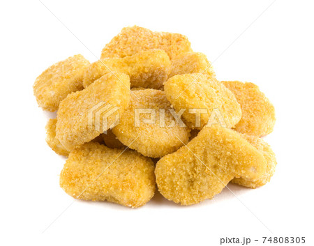 Frozen nuggets on a white background. Several chicken nuggets in breading close-up on a white background. Frozen nuggets on a white background. Several chicken nuggets in breading close-up on a white background. 74808305