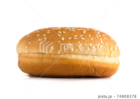 Burger bun on a white background. Bun cut in half close up on a white background. Burger bun on a white background. Bun cut in half close up on a white background. 74808378