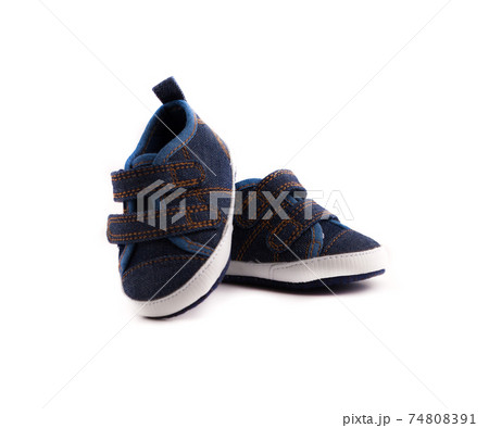 Children's sneakers on a white background. Footwear for babies close up. 74808391