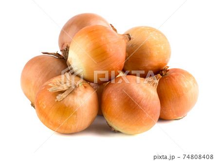 Several onions on a white background. Unpeeled fresh onions close up on a white background. 74808408