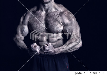 handsome bodybuilder man with muscular body training in gym 74808432
