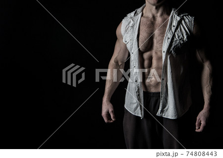 handsome bodybuilder man with muscular body training in gym 74808443