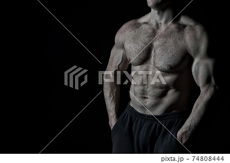 handsome bodybuilder man with muscular body training in gym 74808444