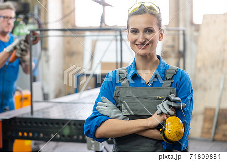 Workers in a metal workshop 74809834