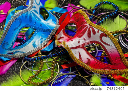 Red And Blue Carnival Masks With Feathers And Jewelry 74812405