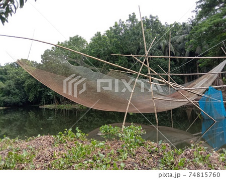 fish tracking net closeup on lake with nature fish tracking net closeup on lake with nature 74815760