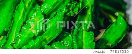 BANNER Spicy asia vegan vegetable salad food with fresh fried dragon grass. Photo use as design background for restaurant, street meal, healthy unhealthy dish concept. Bright Green tone colour 74817530