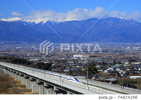 雪を抱いた南アルプスとリニア中央新幹線 74824206