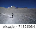 Hiker walking on trekking route on mountain 74826034