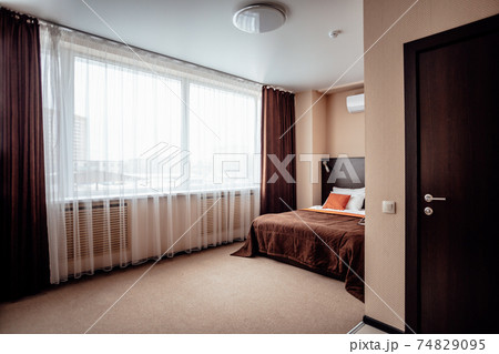 Interior of a comfortable hotel bedroom in the morning in luxury style 74829095