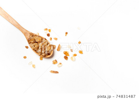 brown sugar on wooden spoon isolated on white background , top view , flat lay. 74831487