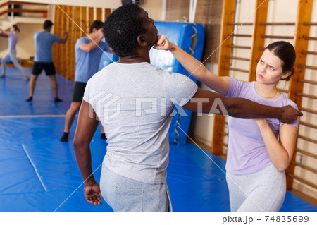 People practicing self defense techniques 74835699