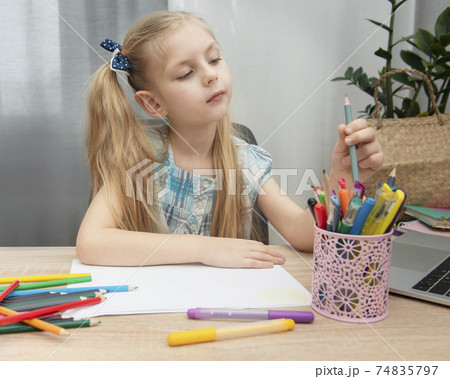 Cute girl doing homework 74835797