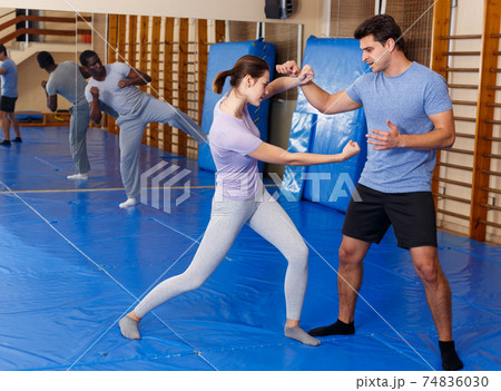 People practicing self defense techniques 74836030