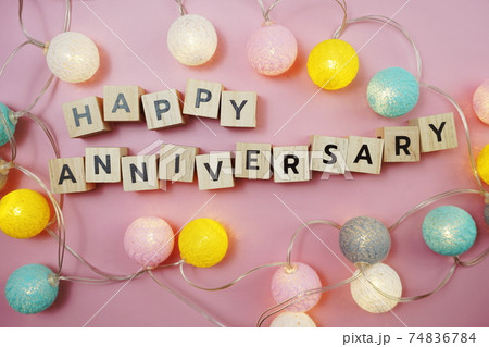 Happy Anniversary alphabet letter with LED cotton balls on pink background 74836784