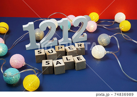 12.12 Super Sale alphabet letter with LED cotton balls on blue  background 74836989