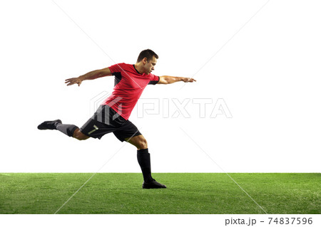 Young football, soccer player of team in action, motion isolated on white background. Concept of sport, movement, energy and dynamic. Young football, soccer player of team in action, motion isolated on white background. Concept of sport, movement, energy and dynamic. 74837596