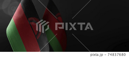 Small national flags of the Malawi on a dark background Small national flags of the Malawi on a dark background 74837680