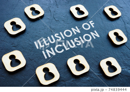 Illusion of Inclusion on the workplace concept. Wooden figures. Illusion of Inclusion on the workplace concept. Wooden figures. 74839444