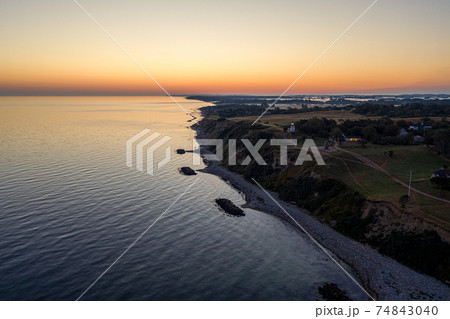 Spodsbjerg Lighthouse and Coastline during Sunrise 74843040