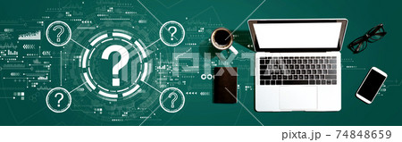 Question marks with a laptop computer 74848659