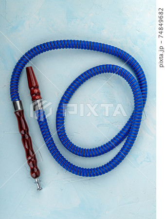 Top view of the blue hookah hose with mouthpieces. 74849682