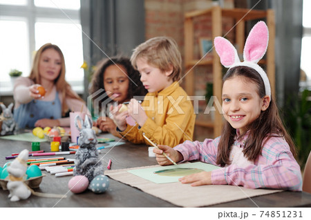 Little girl painting at art lesson 74851231