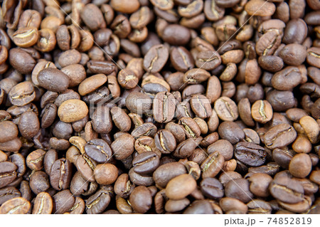 Roasted coffee beans on counter in coffee shop. 74852819