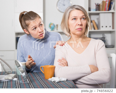 Adult daughter reassures offended mother Adult daughter reassures offended mother 74856822