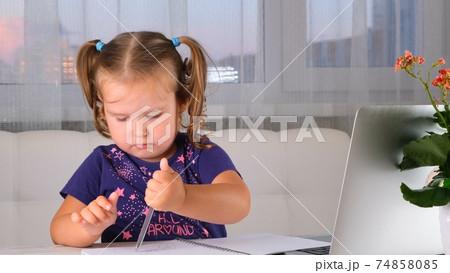 Online lessons for children. Homeschooling and distance education for kids. Girl student study Online lessons for children. Homeschooling and distance education for kids. Girl student study 74858085
