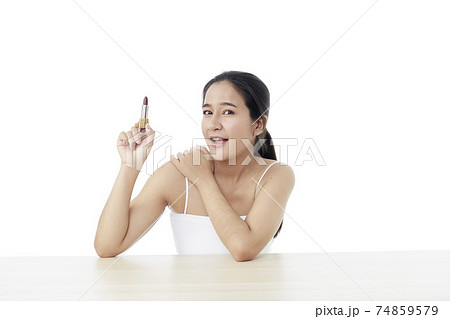 Beautiful woman with lipstick. Beautiful Young Asian Woman with Clean Fresh Skin. Face care, Facial treatment, Cosmetology, beauty, and healthy skin and cosmetic ideas concept 74859579