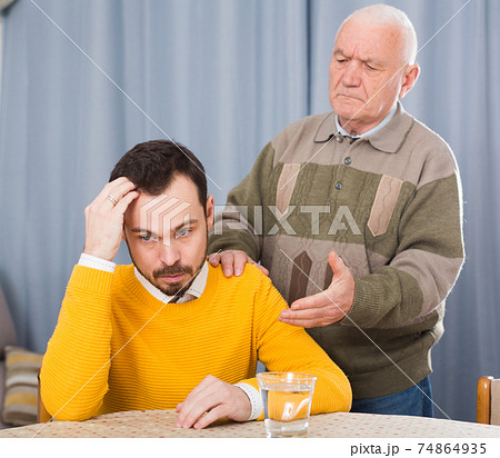 Old father and son serious talk Old father and son serious talk 74864935